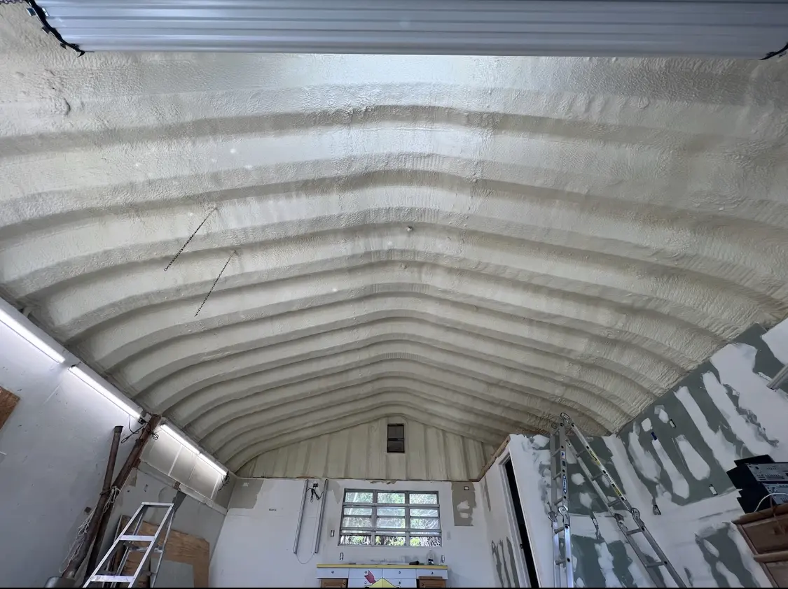Spray polyurethane foam applied to the underside of a metal roof deck in Pewaukee